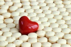 A heart surrounded by pills | Kinesiology | TASK